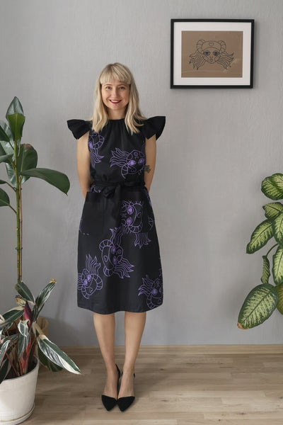 Amelia Earhart Dark Grey Cotton A line dress with oversized butterfly sleeves and Hand printed lavander heroine Lacplesene pattern