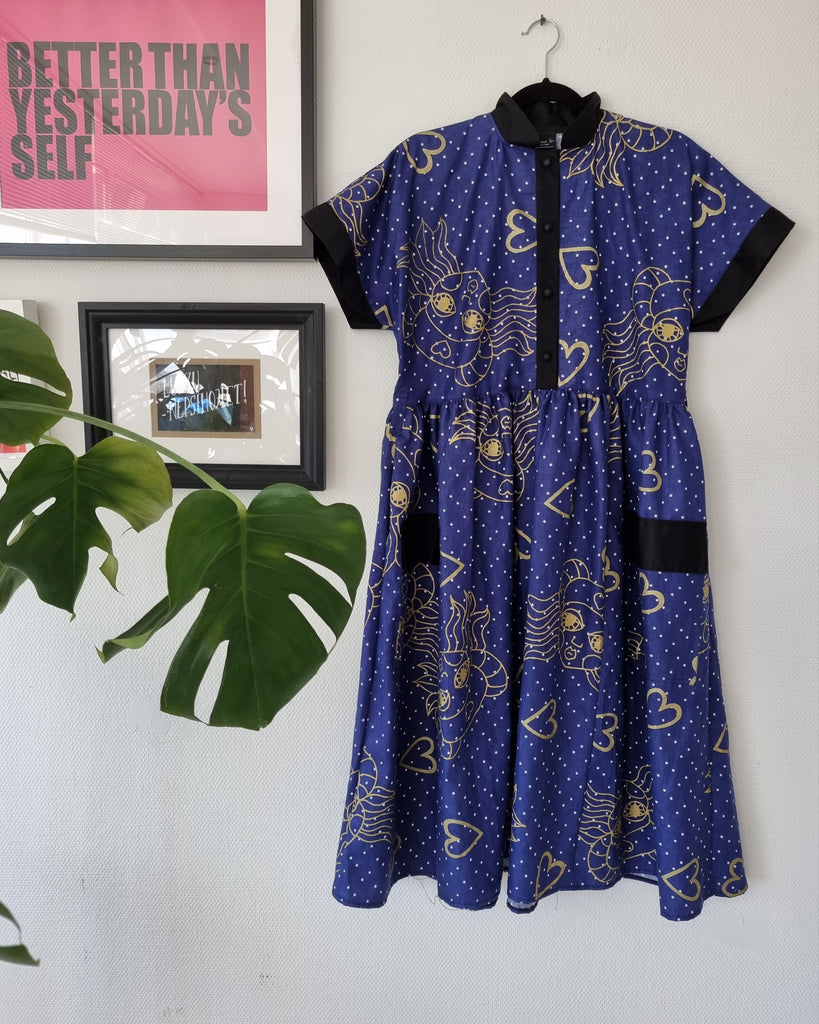 Dark Blue Fun and Cool Short Sleeved Shirt Dress with Wide Skirt Part in Handprinted Patterned Fabric and many Pockets