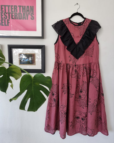 Fun and Special Mauve/Pink Pure Linen dress with Black Handprinted Lāčplēsene Pattern and Statement Ruffle -Billie Holiday