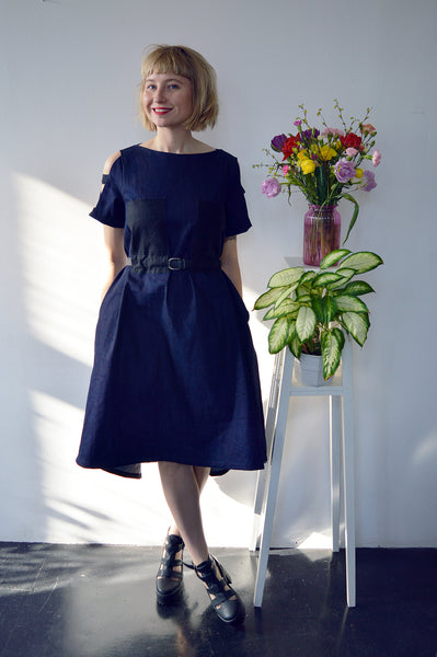 Fresh and New Spring Summer 2018 Dark Blue Statement Denim Dress and Contrast Pockets and Naked Shoulder Detail.