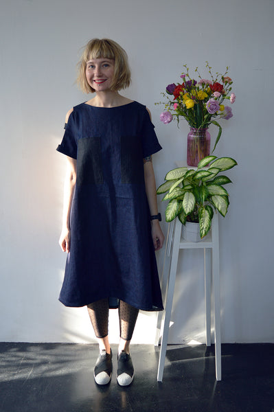 Fresh and New Spring Summer 2018 Dark Blue Statement Denim Dress and Contrast Pockets and Naked Shoulder Detail.