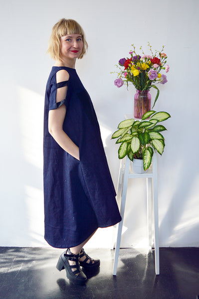 Fresh and New Spring Summer 2018 Dark Blue Statement Denim Dress and Contrast Pockets and Naked Shoulder Detail.